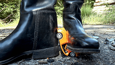 Tiny cars crushed under riding boots