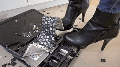 Crushing the slaves laptop under ankle boots