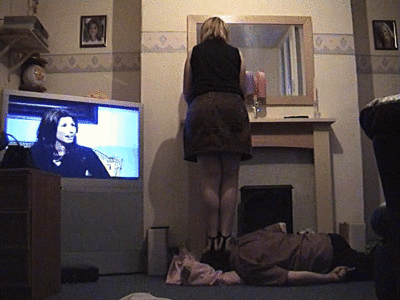 Lisa Doing Her Hair In The Mirror Whilst Stepping On Her Slave